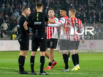 Cracovia players Benjamin Kallman, Amir Al-Ammari, and Bartosz Biedrzycki argue with referees during the game between KS Cracovia and GKS Ka...