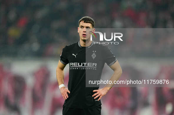 Philipp Sander of Borussia Monchengladbach  controls the ball during the Bundesliga match between RB Leipzig and Borussia Mönchengladbach at...