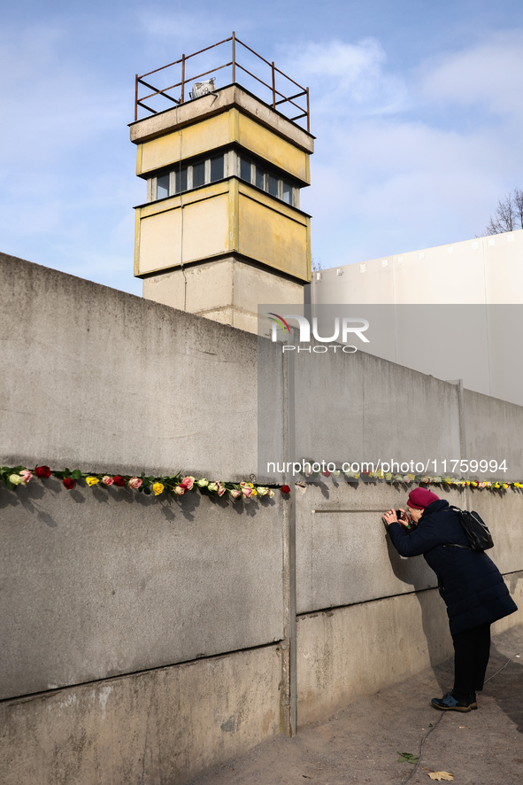 Flowers at Berlin Wall Memorial after the commemoration ceremony marking the 35th anniversary of the fall of the Berlin Wall. Berlin, German...