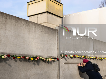 Flowers at Berlin Wall Memorial after the commemoration ceremony marking the 35th anniversary of the fall of the Berlin Wall. Berlin, German...