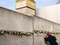 Flowers at Berlin Wall Memorial after the commemoration ceremony marking the 35th anniversary of the fall of the Berlin Wall. Berlin, German...