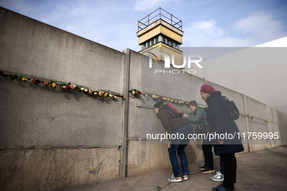 Flowers at Berlin Wall Memorial after the commemoration ceremony marking the 35th anniversary of the fall of the Berlin Wall. Berlin, German...