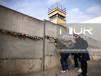 Flowers at Berlin Wall Memorial after the commemoration ceremony marking the 35th anniversary of the fall of the Berlin Wall. Berlin, German...