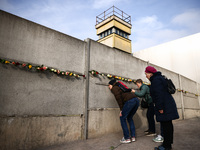 Flowers at Berlin Wall Memorial after the commemoration ceremony marking the 35th anniversary of the fall of the Berlin Wall. Berlin, German...