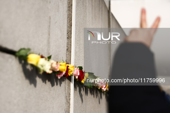 Flowers at Berlin Wall Memorial after the commemoration ceremony marking the 35th anniversary of the fall of the Berlin Wall. Berlin, German...