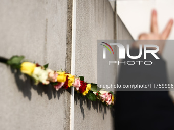 Flowers at Berlin Wall Memorial after the commemoration ceremony marking the 35th anniversary of the fall of the Berlin Wall. Berlin, German...