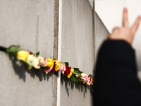 Flowers at Berlin Wall Memorial after the commemoration ceremony marking the 35th anniversary of the fall of the Berlin Wall. Berlin, German...