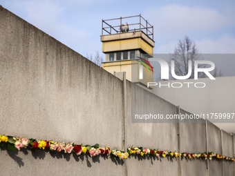 Flowers at Berlin Wall Memorial after the commemoration ceremony marking the 35th anniversary of the fall of the Berlin Wall. Berlin, German...