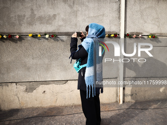 Flowers at Berlin Wall Memorial after the commemoration ceremony marking the 35th anniversary of the fall of the Berlin Wall. Berlin, German...