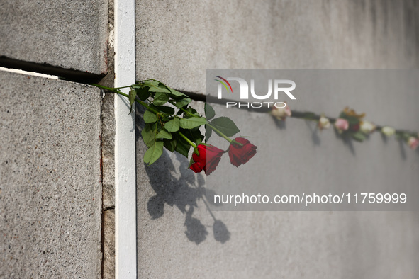 Flowers at Berlin Wall Memorial after the commemoration ceremony marking the 35th anniversary of the fall of the Berlin Wall. Berlin, German...