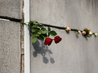 Flowers at Berlin Wall Memorial after the commemoration ceremony marking the 35th anniversary of the fall of the Berlin Wall. Berlin, German...