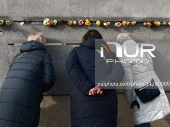 Flowers at Berlin Wall Memorial after the commemoration ceremony marking the 35th anniversary of the fall of the Berlin Wall. Berlin, German...