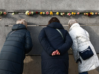 Flowers at Berlin Wall Memorial after the commemoration ceremony marking the 35th anniversary of the fall of the Berlin Wall. Berlin, German...