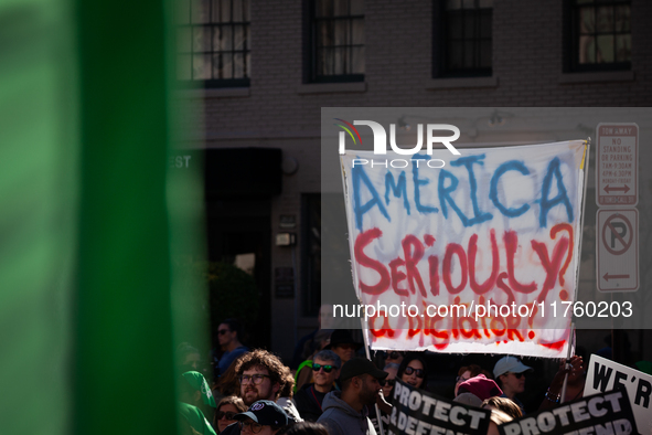 A sign questions electing Donald Trump as the next President of the United States during a demonstration for reproductive rights outside The...