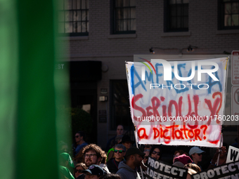 A sign questions electing Donald Trump as the next President of the United States during a demonstration for reproductive rights outside The...