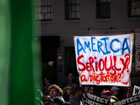 A sign questions electing Donald Trump as the next President of the United States during a demonstration for reproductive rights outside The...