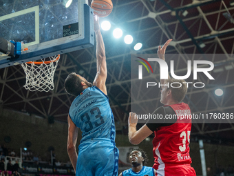 Nikos Chougkaz of Morabanc Andorra and Simon Birgander of UCAM Murcia are in action during the Liga Endesa 2024-2025 match between Morabanc...