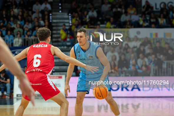 Players are in action during the Liga Endesa 2024-2025 match between Morabanc Andorra and UCAM Murcia at Poliesportiu d'Andorra in Andorra L...