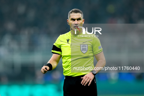 Referee Istvan Kovacs looks on during the UEFA Champions League 2024/25 League Phase MD4 match between FC Internazionale and Arsenal at Stad...