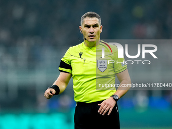 Referee Istvan Kovacs looks on during the UEFA Champions League 2024/25 League Phase MD4 match between FC Internazionale and Arsenal at Stad...