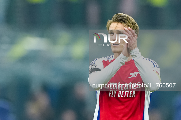 Martin Odegaard of Arsenal greets the fans during the UEFA Champions League 2024/25 League Phase MD4 match between FC Internazionale and Ars...