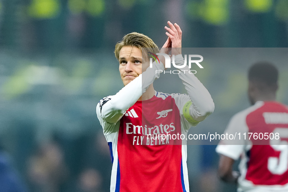 Martin Odegaard of Arsenal greets the fans during the UEFA Champions League 2024/25 League Phase MD4 match between FC Internazionale and Ars...