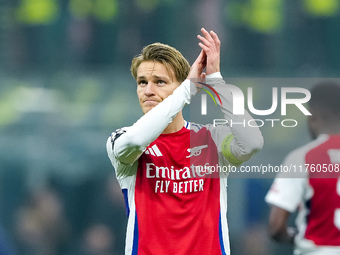 Martin Odegaard of Arsenal greets the fans during the UEFA Champions League 2024/25 League Phase MD4 match between FC Internazionale and Ars...