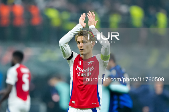 Martin Odegaard of Arsenal greets the fans during the UEFA Champions League 2024/25 League Phase MD4 match between FC Internazionale and Ars...