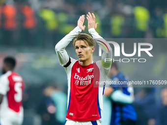 Martin Odegaard of Arsenal greets the fans during the UEFA Champions League 2024/25 League Phase MD4 match between FC Internazionale and Ars...