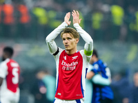 Martin Odegaard of Arsenal greets the fans during the UEFA Champions League 2024/25 League Phase MD4 match between FC Internazionale and Ars...