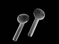 A studio still life of a pair of Apple AirPods on a black background highlights the modern and minimalist design of the AirPods, emphasizing...