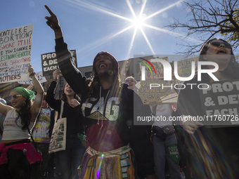 Abortion rights activists gather in front of the Heritage Foundation building during the Women's March in Washington DC, on November 9, 2024...