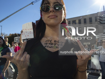 Abortion rights activists gather in front of the Heritage Foundation building during the Women's March in Washington DC, on November 9, 2024...