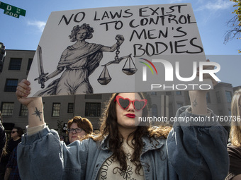 Abortion rights activists gather in front of the Heritage Foundation building during the Women's March in Washington DC, on November 9, 2024...