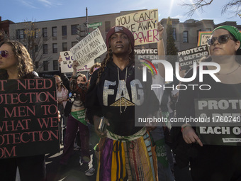 Abortion rights activists gather in front of the Heritage Foundation building during the Women's March in Washington DC, on November 9, 2024...