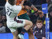 Australia's Lukhan Salakaia-Loto (Randwick) and England's Harry Randall (Bristol Bears) participate in the Autumn Nations Series between Eng...