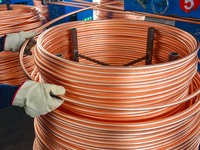 A worker of Yangfan Copper (Anhui) Co LTD works on a production line at the Yuexi County Economic Development Zone in Anqing, China, on Nove...