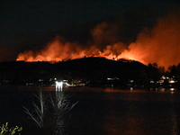 A wildfire is seen on a mountain in West Milford, New Jersey, United States, on November 9, 2024. Firefighters and emergency responders batt...