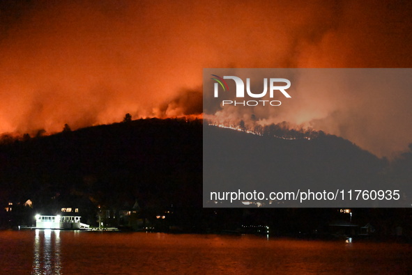 A wildfire is seen on a mountain in West Milford, New Jersey, United States, on November 9, 2024. Firefighters and emergency responders batt...