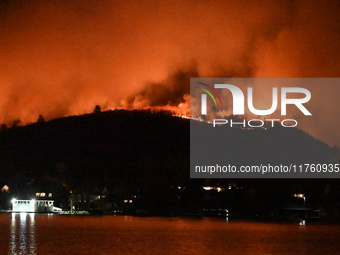 A wildfire is seen on a mountain in West Milford, New Jersey, United States, on November 9, 2024. Firefighters and emergency responders batt...