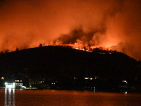 A wildfire is seen on a mountain in West Milford, New Jersey, United States, on November 9, 2024. Firefighters and emergency responders batt...