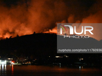 A wildfire is seen on a mountain in West Milford, New Jersey, United States, on November 9, 2024. Firefighters and emergency responders batt...