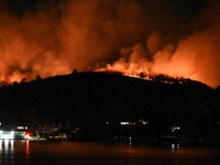 A wildfire is seen on a mountain in West Milford, New Jersey, United States, on November 9, 2024. Firefighters and emergency responders batt...