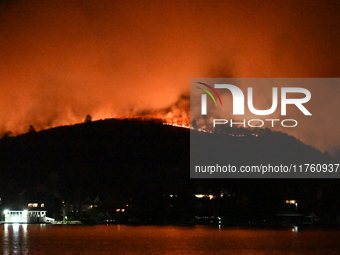 A wildfire is seen on a mountain in West Milford, New Jersey, United States, on November 9, 2024. Firefighters and emergency responders batt...