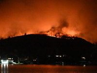 A wildfire is seen on a mountain in West Milford, New Jersey, United States, on November 9, 2024. Firefighters and emergency responders batt...