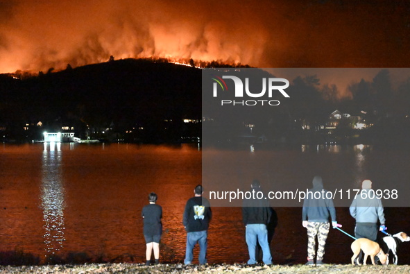 A wildfire is seen on a mountain in West Milford, New Jersey, United States, on November 9, 2024. Firefighters and emergency responders batt...