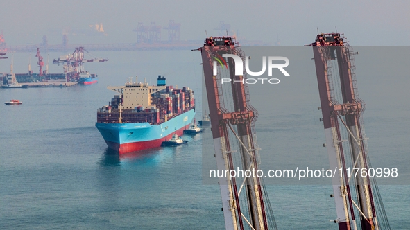 The Maersk Halifax, on the Central and South America route, berths at the Qianwan Container Terminal of Qingdao Port in Qingdao, Shandong Pr...