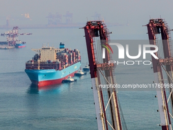 The Maersk Halifax, on the Central and South America route, berths at the Qianwan Container Terminal of Qingdao Port in Qingdao, Shandong Pr...