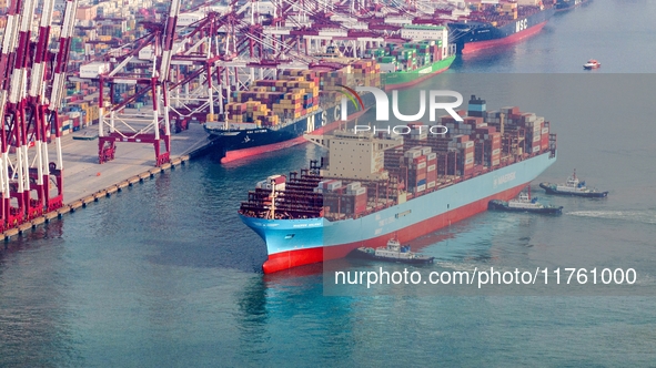 The Maersk Halifax, on the Central and South America route, berths at the Qianwan Container Terminal of Qingdao Port in Qingdao, Shandong Pr...