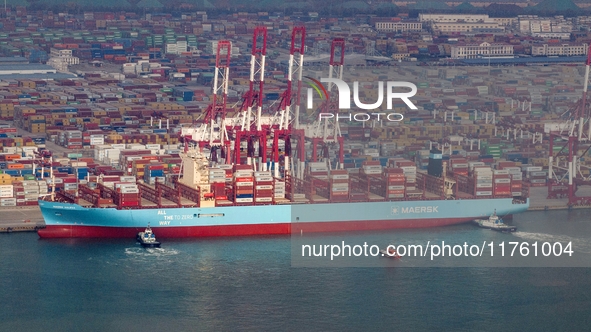 The Maersk Halifax, on the Central and South America route, berths at the Qianwan Container Terminal of Qingdao Port in Qingdao, Shandong Pr...